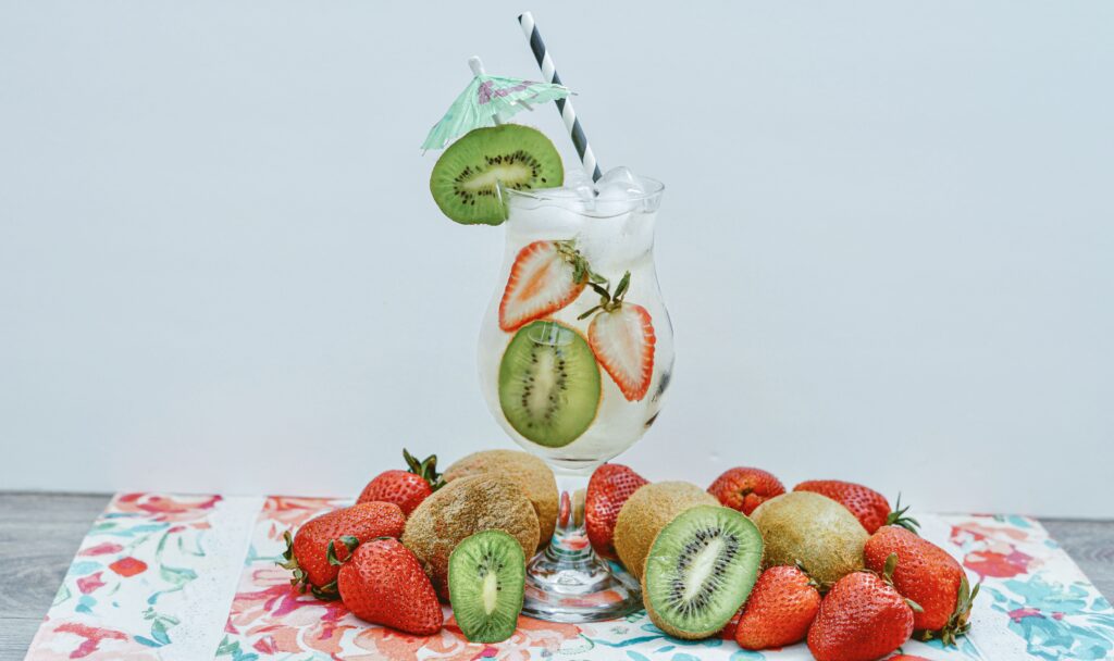  glass with ice cubes, kiwi slices & strawberries.